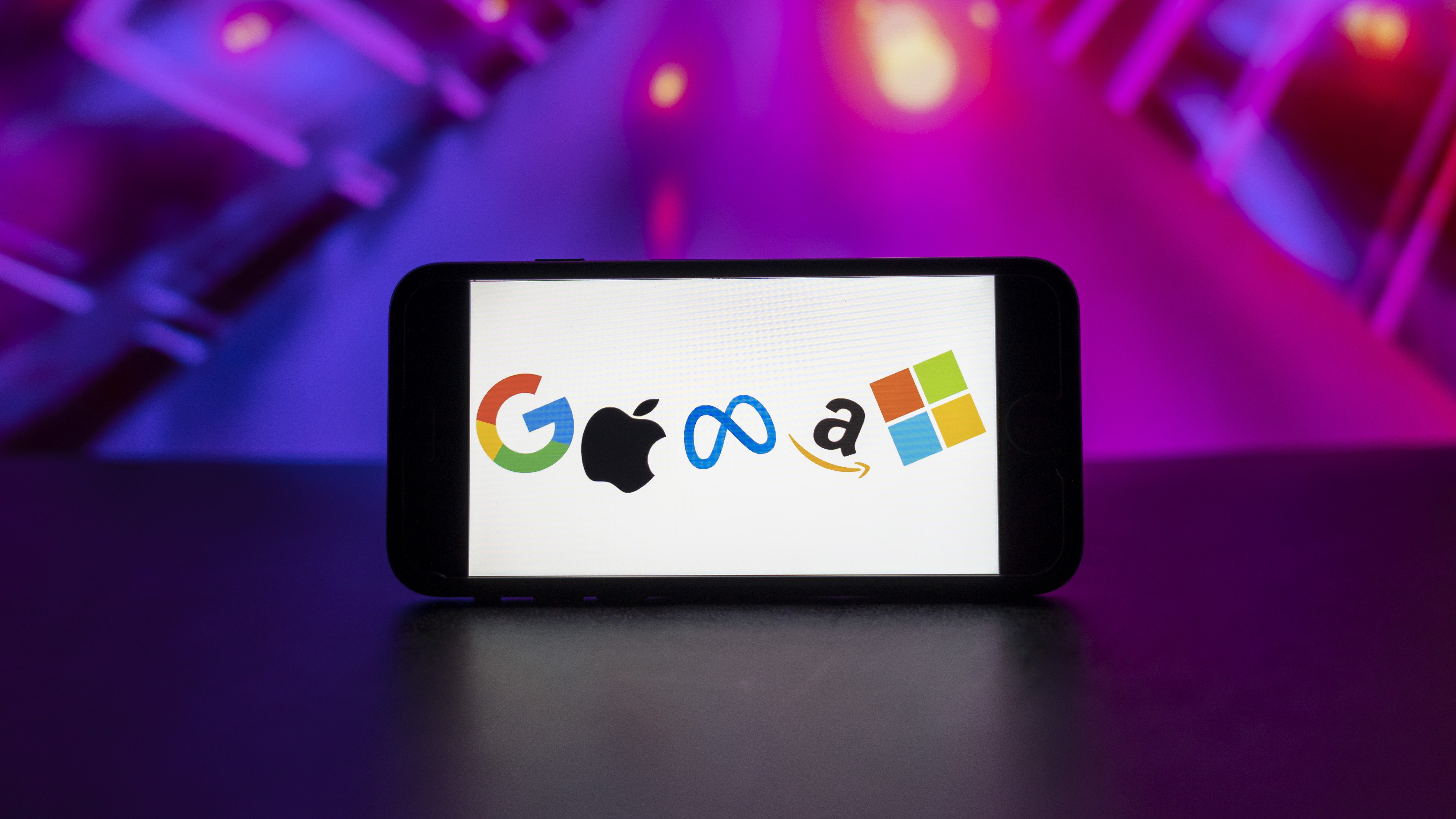 In this photo illustration, the big tech companies Google, Apple, Meta, Amazon, Microsoft logos seen displayed on a mobile phone screen.