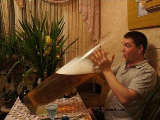 funny-man-drinking-beer-in-biggest-glass-of-world.jpg